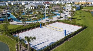 A resort with a large sandy beach area, multiple swimming pools, and a variety of villas. - King Bed | Disney Contemporary Townhouse (Kissimmee)