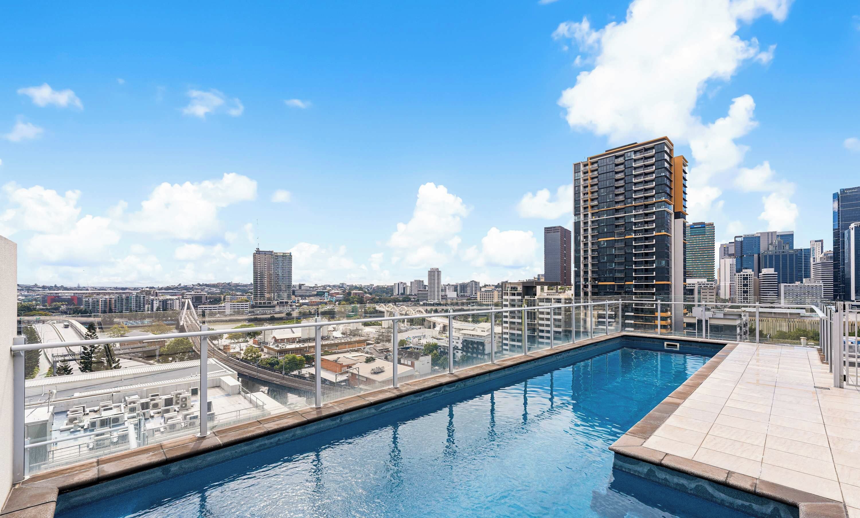 Stunning rooftop pool with views out over Brisbane's CBD
