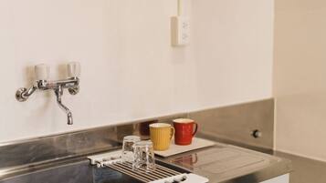 Japanese-style Quadruple Room, Non Smoking | Private kitchen | Mini-fridge, shared microwave