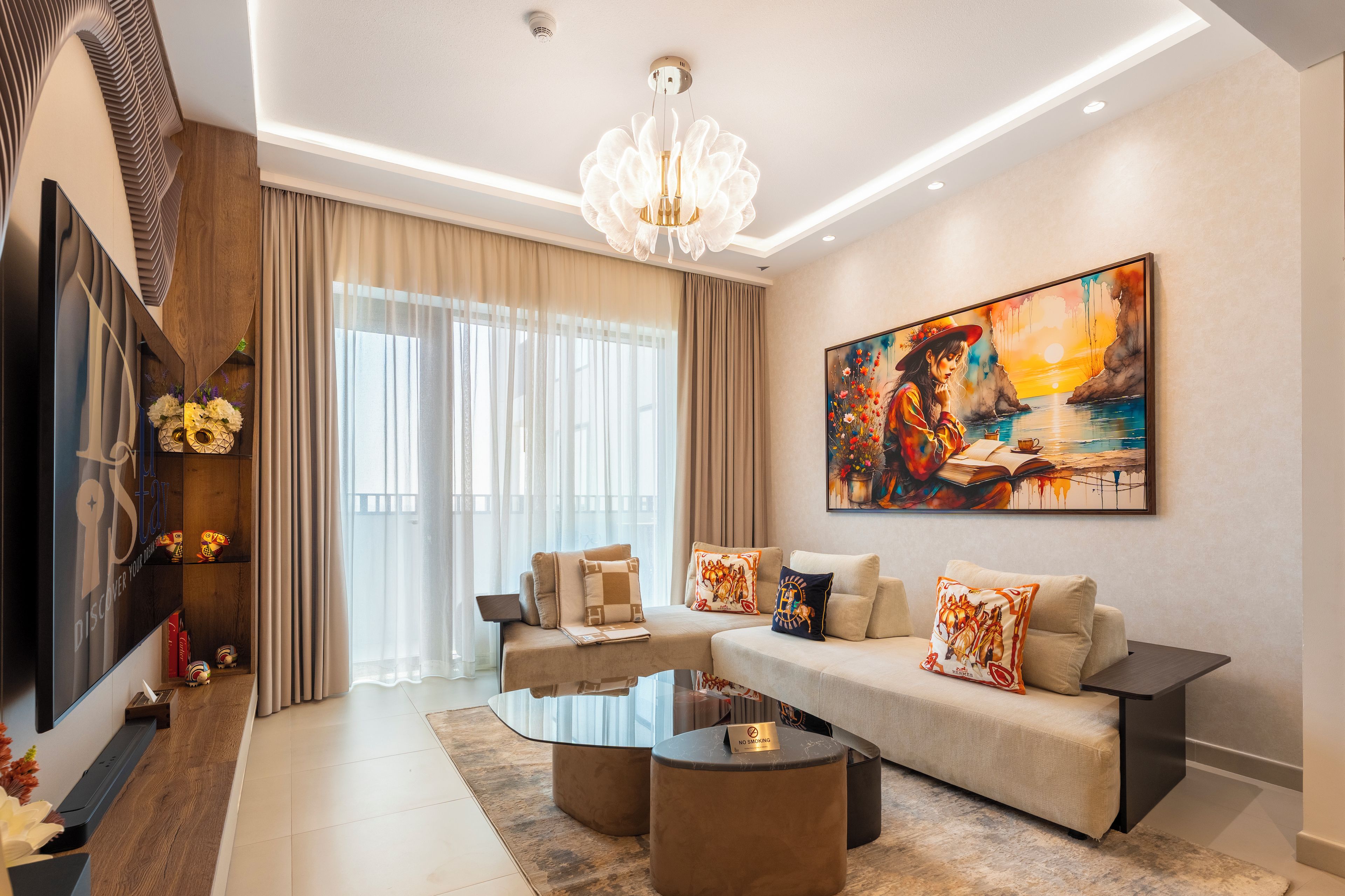 A modern living room with a sofa, coffee table, and artwork on the wall.