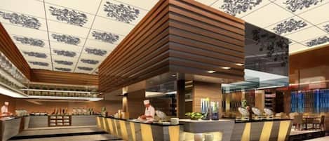 A modern hotel lobby with a reception desk, seating area, and a decorative ceiling.