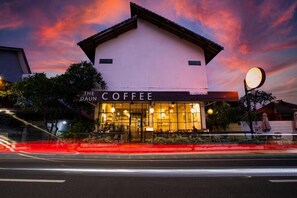A building with a sign reading 'The Coffee' at dusk. - The Daun Bali Canggu (Badung)