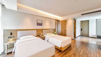 Exclusive Suite, City View | In-room safe, desk, laptop workspace, blackout drapes