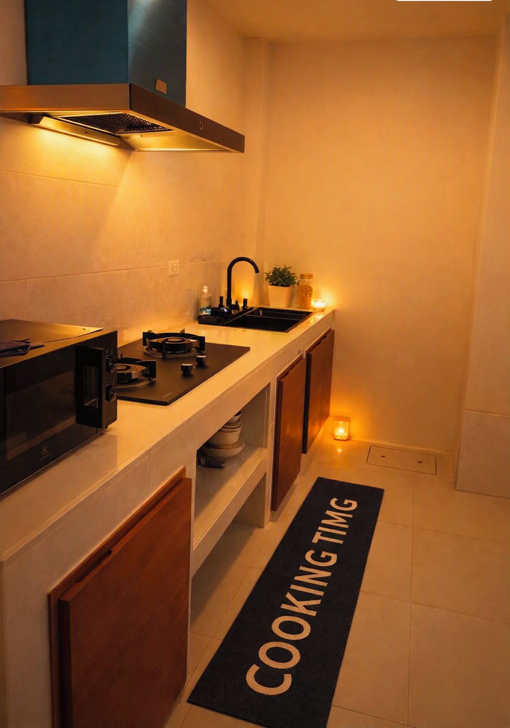 A modern kitchen with a microwave, stove, and sink.