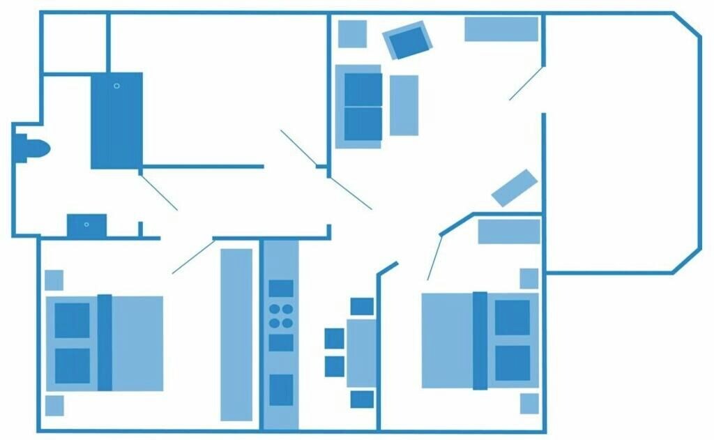 Plano de planta que muestra varias habitaciones, una zona de cocina y un baño.