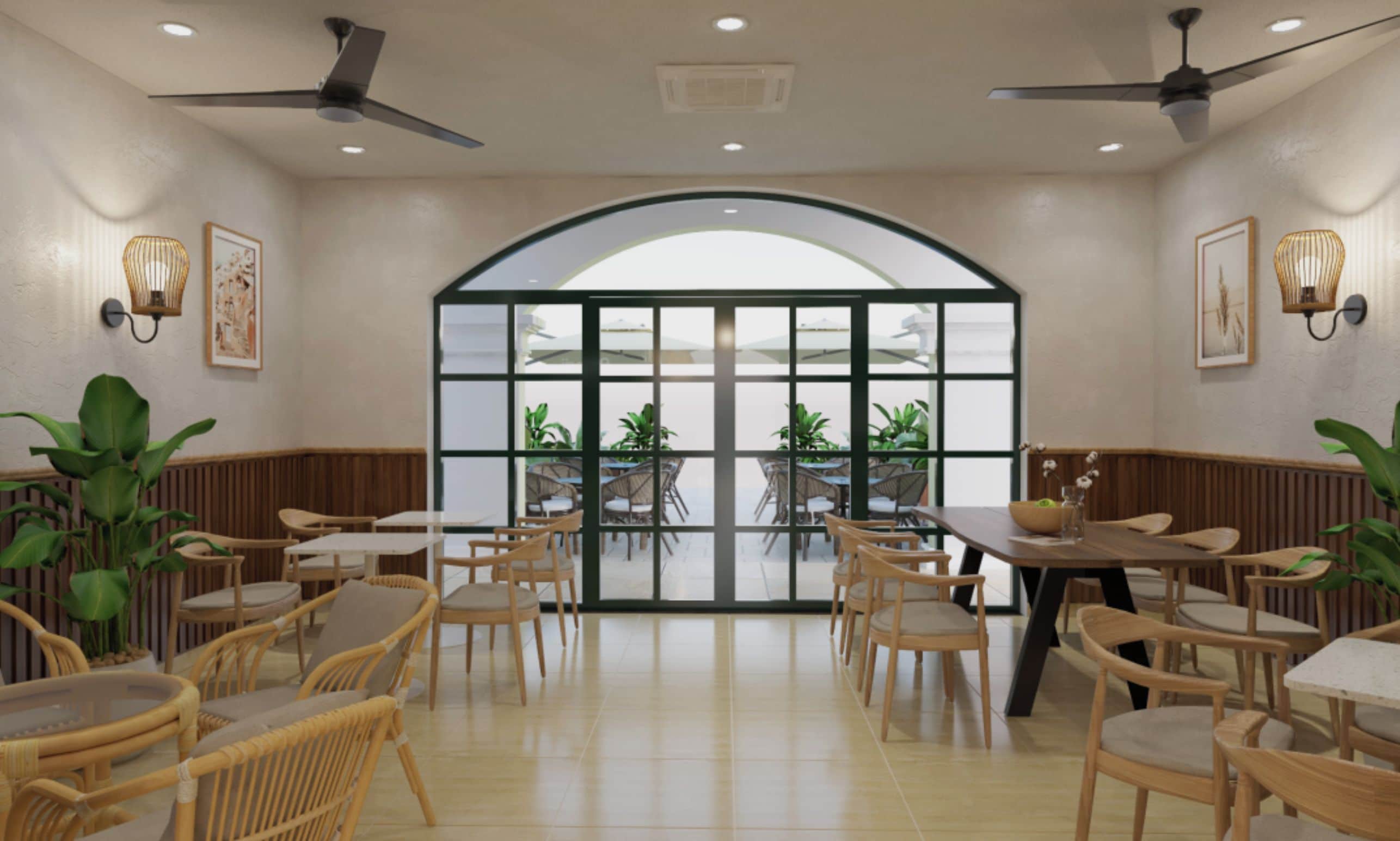 A spacious indoor dining area with high ceilings, ceiling fans, and a large arched glass door leading outside.