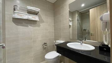 Shower, hair dryer, slippers, towels