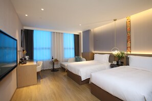 A hotel room with two beds, a desk, a chair, a TV, and a window with curtains. - The Skytel Beijing Aoyu (Daxing)