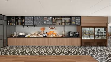 A modern kitchen with a central island, overhead menu boards, and a coffee machine.