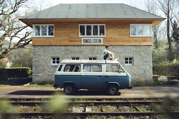 A van parked in front of a stone building with a sign that reads 'RINGELSTEIN'. - Stellwerk Ringelstein: Forest-Edge Retreat with Sauna, Fireplace, Terrace & Wi-Fi (Büren)