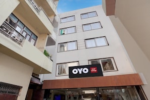 A multi-story building with a sign for 'OYO Hotel Vintage' indicating a hotel establishment. - Hotel O Vintage (New Delhi)