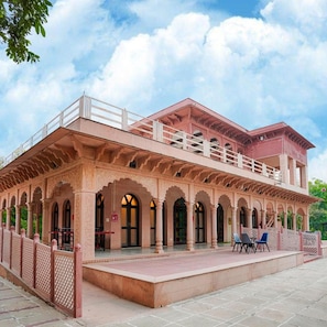 A two-story building with a balcony and arched windows. - Club Mahindra Bharatpur (Bharatpur)