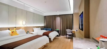 A hotel room with two beds, a desk, a chair, a large mirror, and a window with curtains.