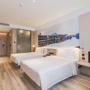 A hotel room with two beds, a large window, a cityscape view, and a modern design. - Atour Hotel (Jiaxing)