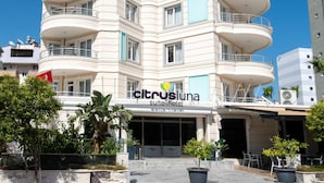 A multi-story hotel with balconies, a visible entrance, and a sign for 'Citrusluna Suite Hotel'. - Theluna Suite Hotel (Konyaalti)