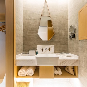 A modern bathroom with a dual sink vanity, a hanging mirror, and a towel storage area. - Atour Hotel Wangting Suzhou (Suzhou)