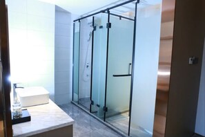 A modern bathroom with a glass shower enclosure, a white sink, and a marble countertop. - Borrman Hotel Hengyang Huaxin Caixia Street (Hengyang)