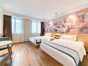 A hotel room with two beds, a desk, and a large window with curtains. - City Comfort lnn Lijiang Transportation Station (Lijiang)