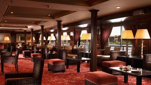 A hotel lobby with multiple seating areas, including sofas and chairs, arranged around tables. - JAZ Crown Jubilee Nile Cruise - Thursday VIA Luxor 7 & 4nts - Monday VIA Aswan 3nts (Luxor)