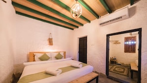A bedroom with a wooden bed, a bench, a hanging basket, and a mirror reflecting a bathroom. - Sama Wakan (Wakan)