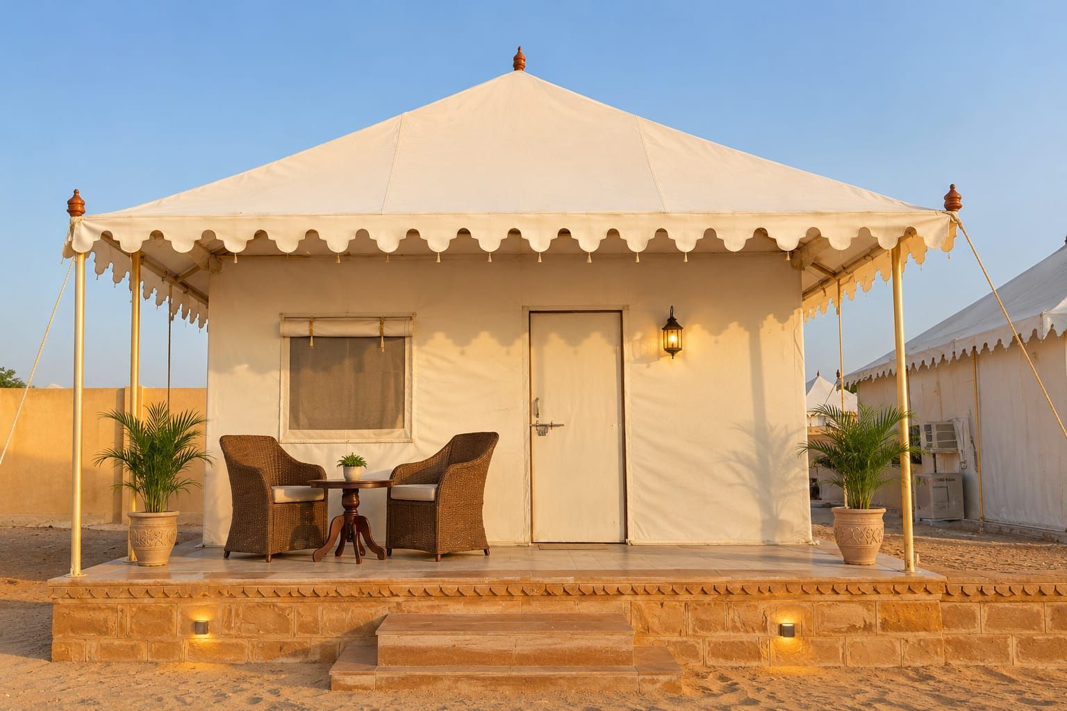 A tented accommodation with a dining area, a door, and a window.