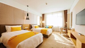 A hotel room with two beds, a desk, a chair, a television, and a large window with curtains. - Club Med Joyview Beijing Yanqing (Beijing)