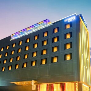 A hotel building with a modern design, featuring a flat facade with multiple windows and a prominent sign at the top. - Pride Elite Chhatrapati Sambhajinagar (Chhatrapati Sambhajinagar)