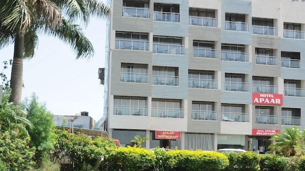 A multi-story hotel building with a sign for the 'Hotel A'Paar' and a restaurant. - Hotel Apaar (Diu)