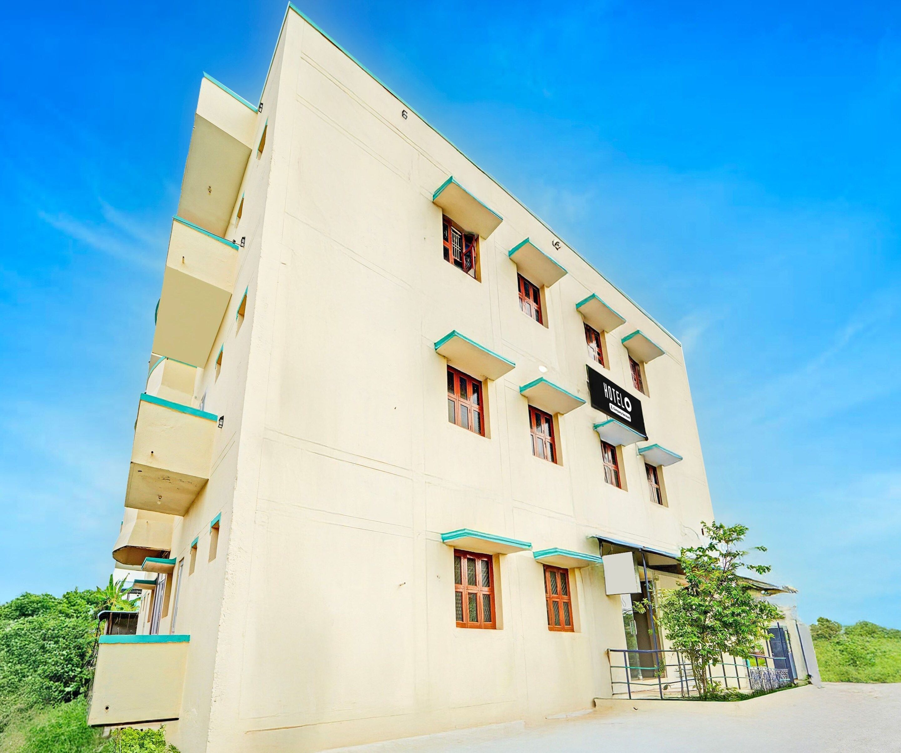 A multi-story hotel building with a sign indicating it is a hotel.