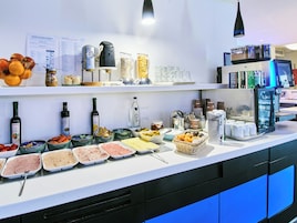 A buffet with various food items and condiments.