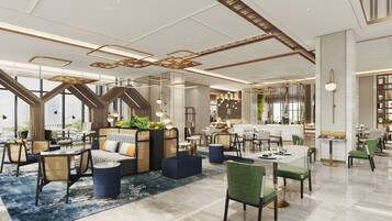 A modern hotel lobby with seating areas, a bar, and a dining space.