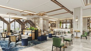 Un moderno vestíbulo de hotel con zonas de estar, un bar y un comedor.