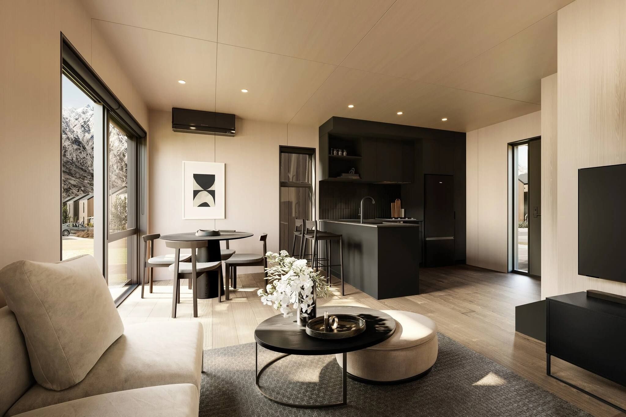 A modern living room with a sofa, a coffee table, and a dining area with chairs and a table.
