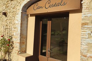 A building facade with a sign reading 'Can Costals.' - Can Costals Cerezo in Pals (Els Masos de Pals)