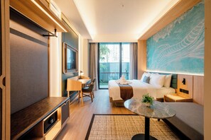 A hotel room with a bed, desk, chair, TV, and a large window. - ATSINI Pererenan (Pererenan)