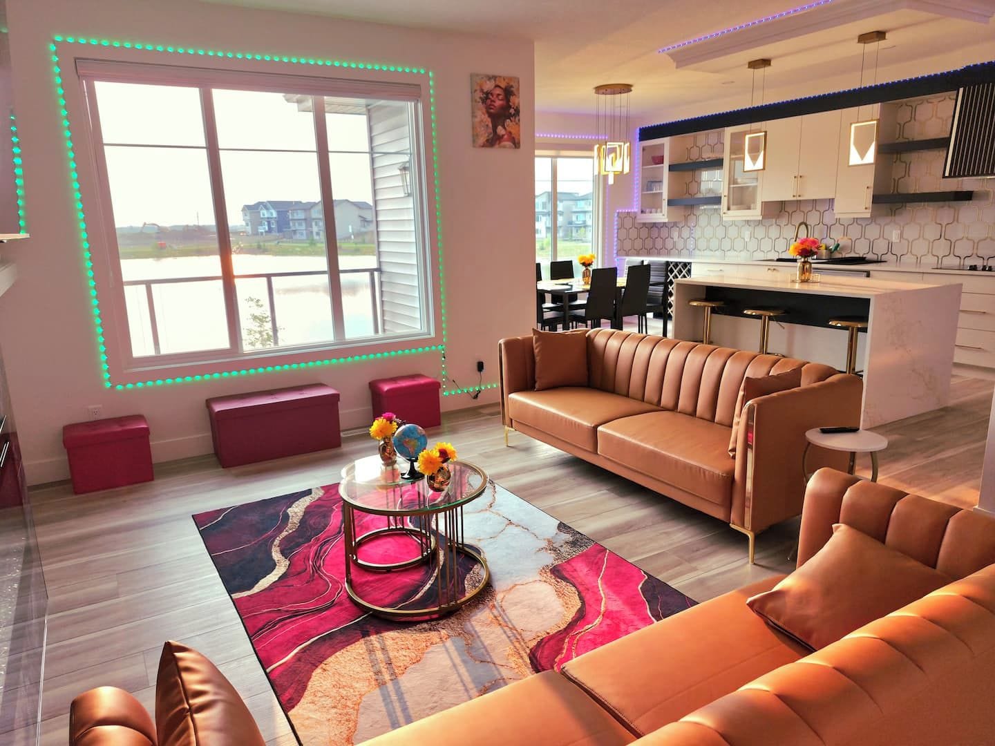 A modern living room with a sectional sofa, a coffee table, and a view of the outside.
