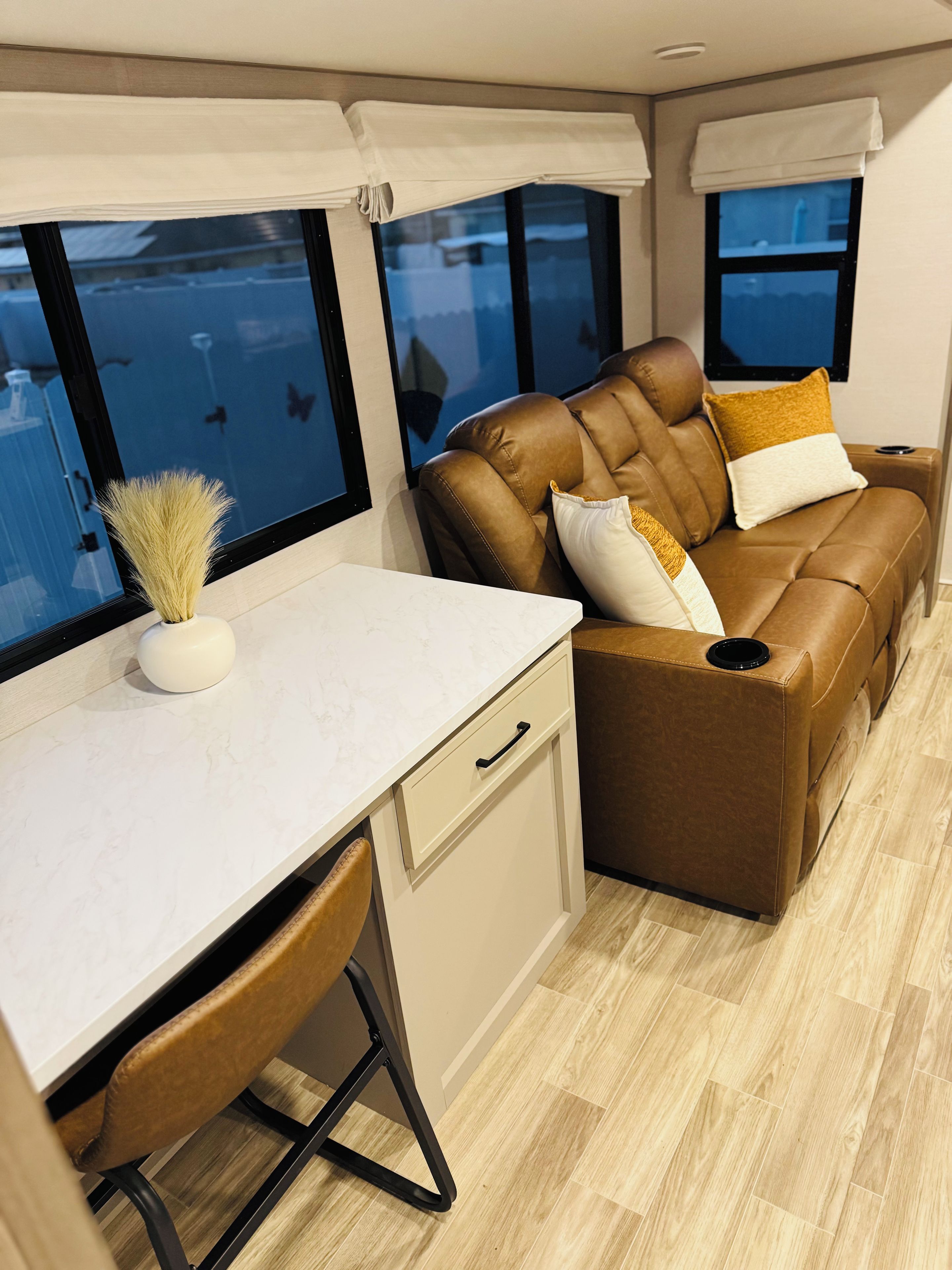 A compact living space with a sofa, a small table, and a chair.