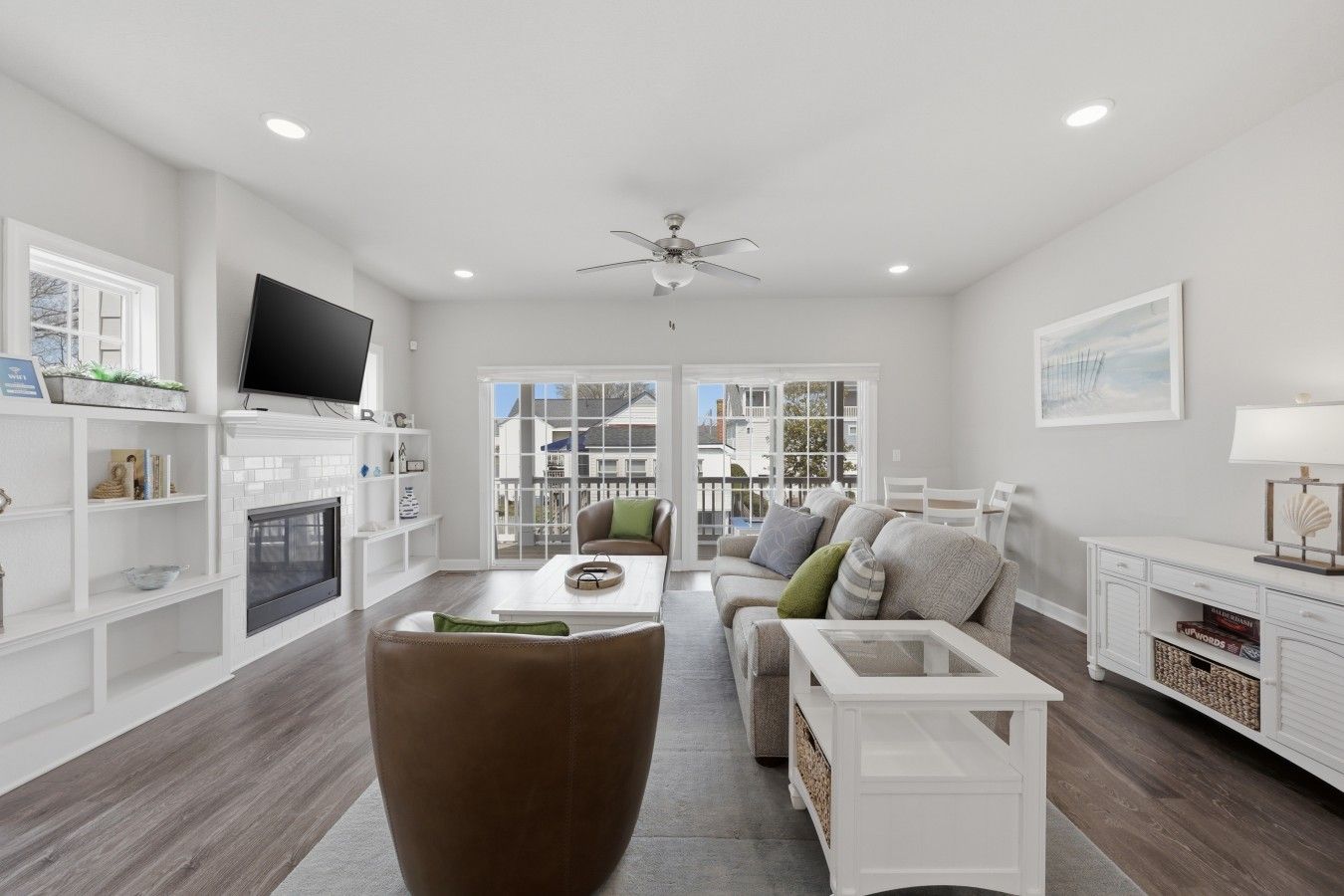 A modern living room with a fireplace, television, and seating area.