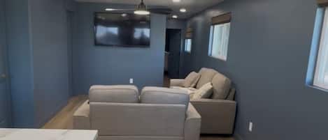 A modern kitchen with a marble countertop and a built-in oven.
