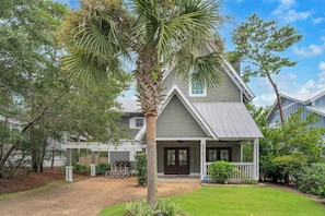 A two-story house with a covered porch, a palm tree, and a bicycle in the driveway. - Come & Sea by Stay on 30a (Inlet Beach)