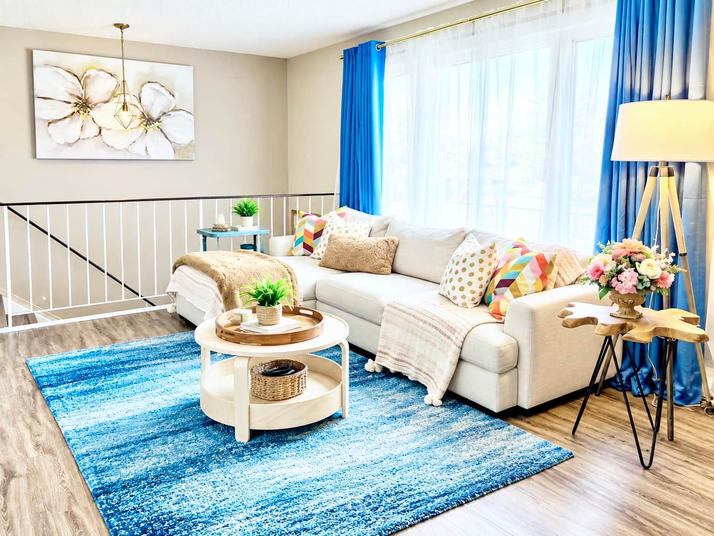A modern living room with a sofa, coffee table, and a lamp.