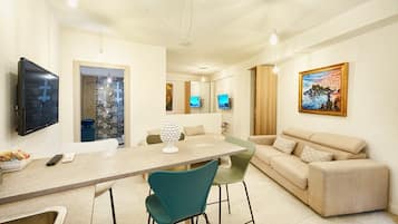Family Apartment | Living area | 50-inch LED TV with digital channels, printers