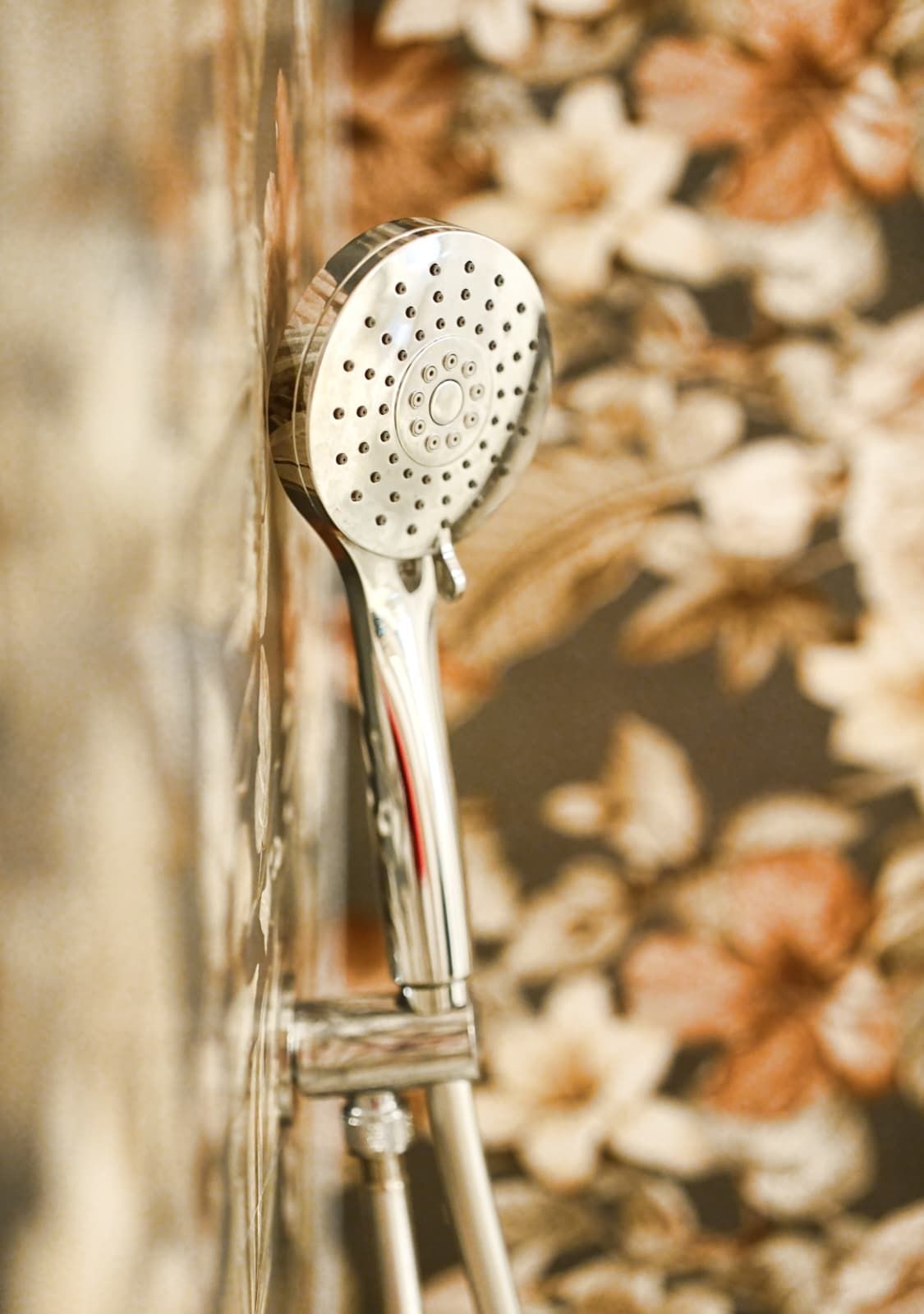 A showerhead with a circular design and multiple nozzles.