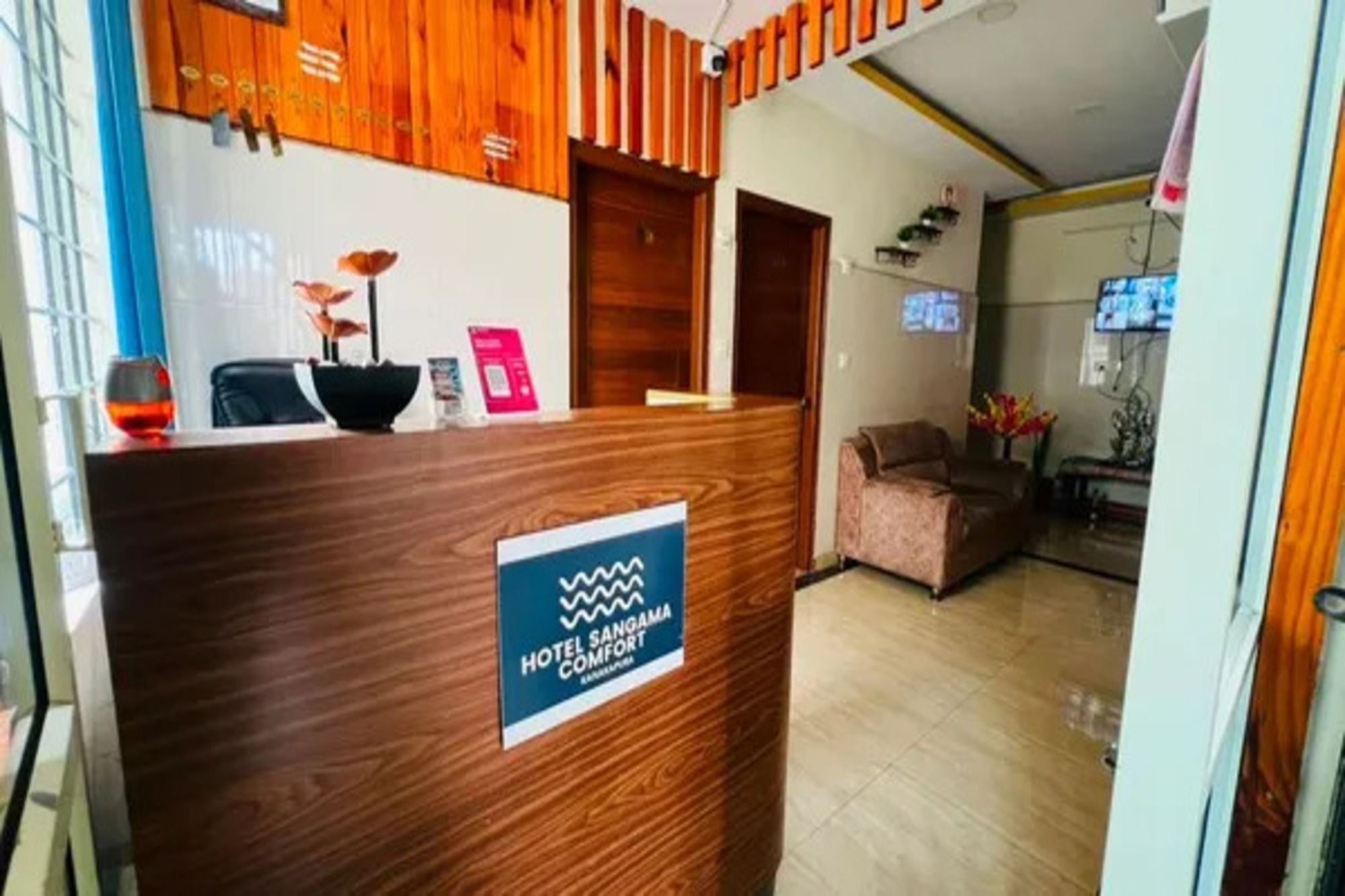 A reception desk with a sign indicating a hotel comfort.