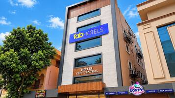 A modern hotel building with a sign for 'Tab Hotels' and 'Hotel City Central' on the facade.