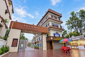 A hotel entrance with a sign for 'SHEHNAI Banquet & Lawn' and a 'Hotel Rajdhani Heritage' sign. - FabHotel Rajdhani Heritage (Ranchi)