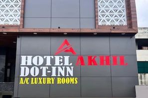 A building with a sign for 'HOTEL DOT-INN A/C LUXURY ROOMS'. - Fabhotel Akhil Dot Inn (Khammam)