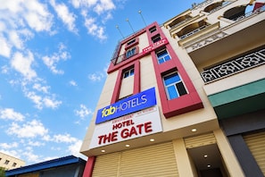 A hotel named 'The Gate' with a sign indicating 'fabHOTELS' and 'A/C rooms'. - FabHotel The Gate (Hyderabad)