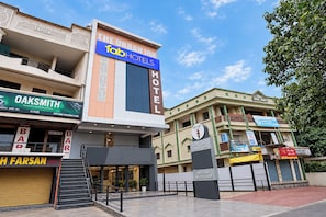 A hotel with a prominent sign for 'The Urban Inn' and 'Fab Hotels'.