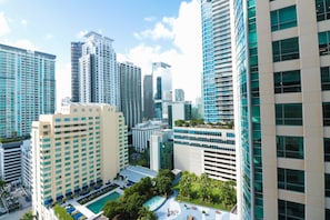 A high-rise hotel with multiple floors, a rooftop pool, and a well-maintained garden area. - Chill Studio Getaway Luxury Brickell High Rise (Miami)